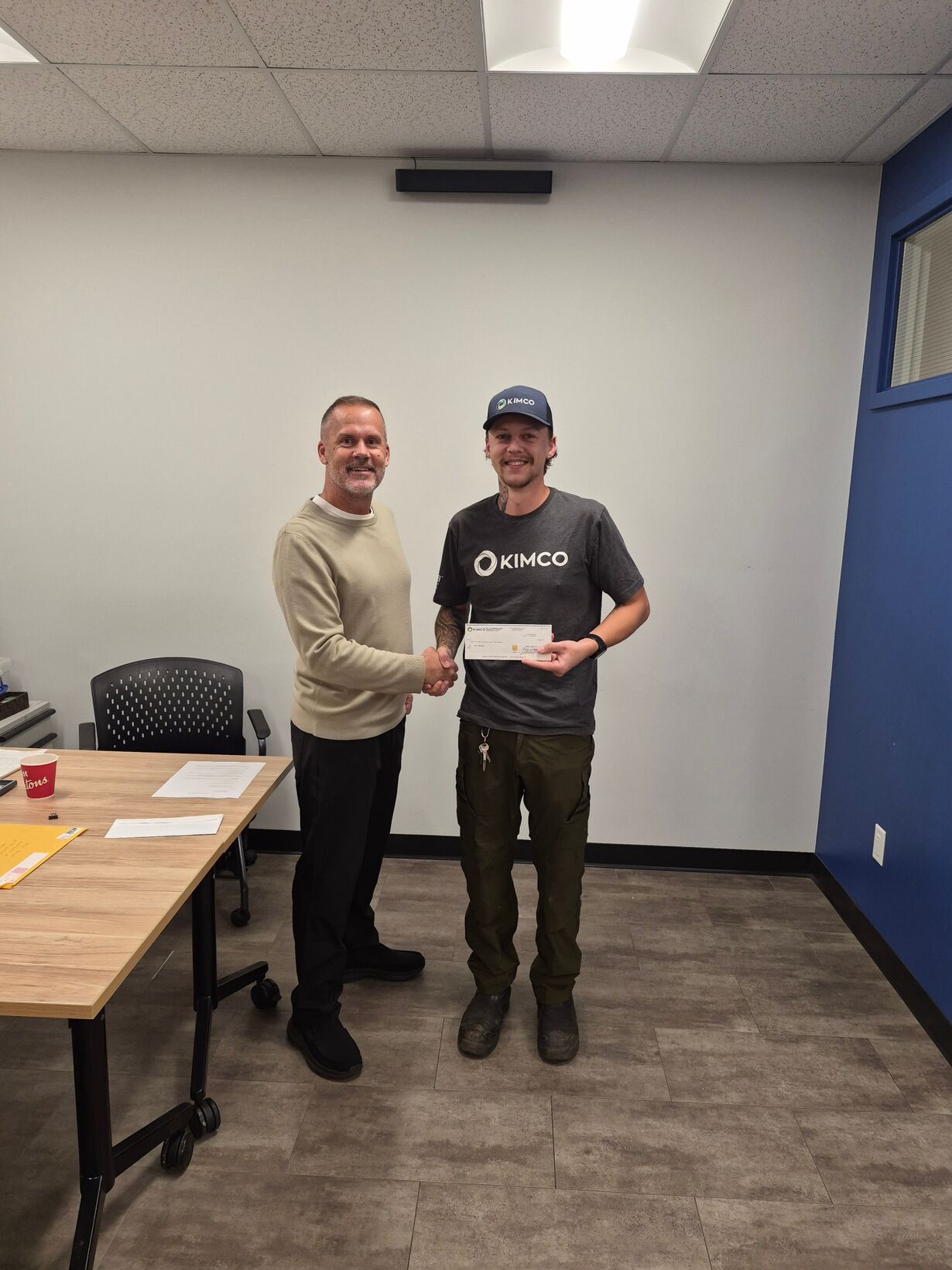 Zach Hornby gets a handshake and a thank-you for 5 years with Kimco.
